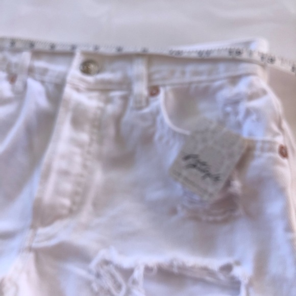 Free People Optic White Maggie Mid-Rise Button Front Fly Distressed Jean Shorts - Picture 7 of 14